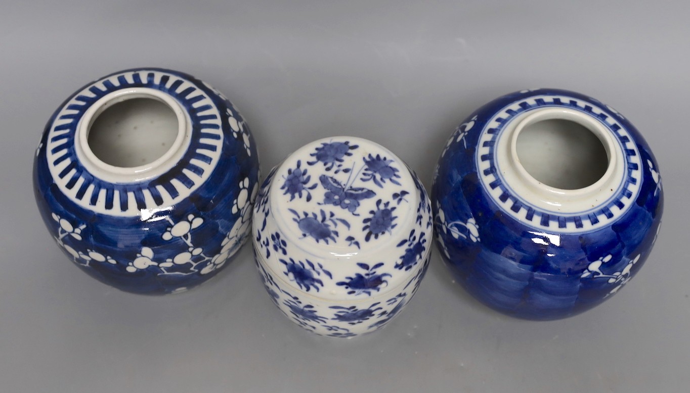 Two 19th century blue and white prunus jars and a barrel jar and cover. 12cm